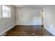 Simple living room with hardwood floors and damage at 231 Glenrose Sw Cir, Atlanta, GA 30354