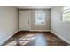 Living room with hardwood floors and large window at 231 Glenrose Sw Cir, Atlanta, GA 30354