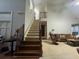 Elegant staircase with wooden steps and wrought-iron railings at 1030 Silver Thorne Dr, Loganville, GA 30052