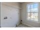 Laundry room with shelving and window at 323 Berkley Dr, Villa Rica, GA 30180