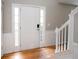 Front entry with hardwood floor and white door at 3390 Northcliff Dr, Suwanee, GA 30024