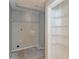 Laundry room with built-in shelving at 3390 Northcliff Dr, Suwanee, GA 30024