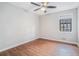 Simple bedroom with hardwood floors and a large window at 2649 Porter Dr, Lawrenceville, GA 30044