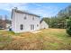 Back view of the two-story home, backyard and houses nearby at 4872 Antelope Cv, Atlanta, GA 30349