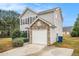 A two-story home with stone accents, driveway, and front yard at 4872 Antelope Cv, Atlanta, GA 30349