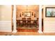 Elegant dining room with hardwood floors, chandelier, and built-in cabinetry at 710 Trumpeter Ct, Fairburn, GA 30213