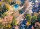 Aerial showing home, tennis court, community garden, and surrounding neighborhood at 111 Swanton Hill Ct, Decatur, GA 30030