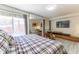 Comfortable bedroom with large TV and sliding glass door to backyard at 111 Swanton Hill Ct, Decatur, GA 30030