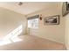 Well-lit bedroom featuring a built-in shelf and carpeted floor at 111 Swanton Hill Ct, Decatur, GA 30030