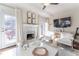 Spacious living area with fireplace and access to a deck at 111 Swanton Hill Ct, Decatur, GA 30030