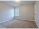 Bright bedroom featuring neutral walls and carpeted floor at 3010 Reynolds Run, Mcdonough, GA 30252