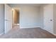 Well-lit bedroom with neutral walls and carpet, plus an additional closet at 3010 Reynolds Run, Mcdonough, GA 30252