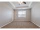 Spacious carpeted bedroom with ceiling fan and large window at 3010 Reynolds Run, Mcdonough, GA 30252