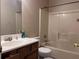 Bathroom with shower/tub combo, toilet and single vanity at 347 Waits Sw Dr, Atlanta, GA 30331