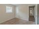 Bedroom with neutral walls, carpet flooring, and access to hallway at 6103 Oakwood Sw Cir, Covington, GA 30014