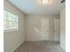 Spacious bedroom featuring neutral walls, carpet flooring, and ample natural light at 6103 Oakwood Sw Cir, Covington, GA 30014