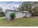 Another side view of the house, highlighting its gray brick exterior at 6103 Oakwood Sw Cir, Covington, GA 30014