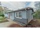 Side view of the house showcasing its gray siding and landscaping at 6103 Oakwood Sw Cir, Covington, GA 30014