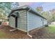 Gray house exterior with a side door and small yard at 6103 Oakwood Sw Cir, Covington, GA 30014