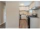 Updated kitchen with stainless steel appliances and granite countertops at 6103 Oakwood Sw Cir, Covington, GA 30014