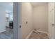 Laundry area with vinyl flooring and space for washer and dryer at 6103 Oakwood Sw Cir, Covington, GA 30014