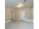 Spacious living room with neutral colored walls and carpeted floors at 6103 Oakwood Sw Cir, Covington, GA 30014