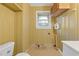 Simple bathroom with tiled floor and a toilet at 2081 Dodson Sw Dr, Atlanta, GA 30311