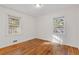 Bright bedroom with hardwood floors and large windows at 2081 Dodson Sw Dr, Atlanta, GA 30311