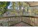 Wooden deck overlooking backyard with mature trees at 2081 Dodson Sw Dr, Atlanta, GA 30311
