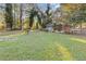 Ranch house with a large grassy yard and trees at 2081 Dodson Sw Dr, Atlanta, GA 30311
