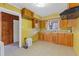 Kitchen with wood cabinets and yellow walls at 2081 Dodson Sw Dr, Atlanta, GA 30311