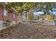 Side yard with mature trees and leaves at 2081 Dodson Sw Dr, Atlanta, GA 30311