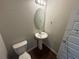 Clean bathroom with pedestal sink and oval mirror at 2754 Topaz Rd, Riverdale, GA 30296