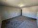 Simple bedroom with carpeted floor and neutral walls at 2754 Topaz Rd, Riverdale, GA 30296