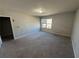 Large bedroom with neutral walls and carpeted floors at 2754 Topaz Rd, Riverdale, GA 30296