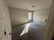 Bedroom with window and neutral walls at 2754 Topaz Rd, Riverdale, GA 30296