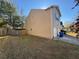 Rear view of house showcasing a side yard and garage at 2754 Topaz Rd, Riverdale, GA 30296