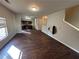 Open living area with dark hardwood floors at 2754 Topaz Rd, Riverdale, GA 30296