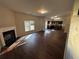 Open living room with kitchen view and fireplace at 2754 Topaz Rd, Riverdale, GA 30296
