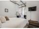 Main bedroom with a large bed and a view into the living area at 426 Marietta Nw St # 410, Atlanta, GA 30313