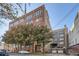 Brick building with trees and parking in front at 426 Marietta Nw St # 410, Atlanta, GA 30313