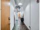 Long hallway with exposed pipes and concrete floors at 426 Marietta Nw St # 410, Atlanta, GA 30313