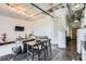 Open living space with gray couch and exposed industrial features at 426 Marietta Nw St # 410, Atlanta, GA 30313