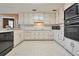 Classic kitchen with ample cabinetry and a microwave at 4605 Tims Pl, Snellville, GA 30039