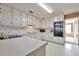 Kitchen with white cabinets, tile floor, and appliances at 4605 Tims Pl, Snellville, GA 30039