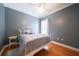 Bright bedroom with hardwood floors and a ceiling fan at 6135 Mapperley Ln, Cumming, GA 30041