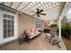 Covered patio with ceiling fan and comfortable seating at 6135 Mapperley Ln, Cumming, GA 30041