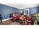 Living room featuring dark wood furniture and blue walls at 3978 Pate Rd, Loganville, GA 30052