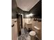 Modern bathroom with patterned floor and dark walls at 508 Grace Ct, Temple, GA 30179