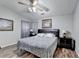 Main bedroom with ceiling fan and wood-look floors at 470 Paris Dr, Lawrenceville, GA 30043